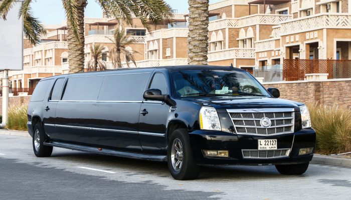 Black luxurious limousine Cadillac Escalade in the city street