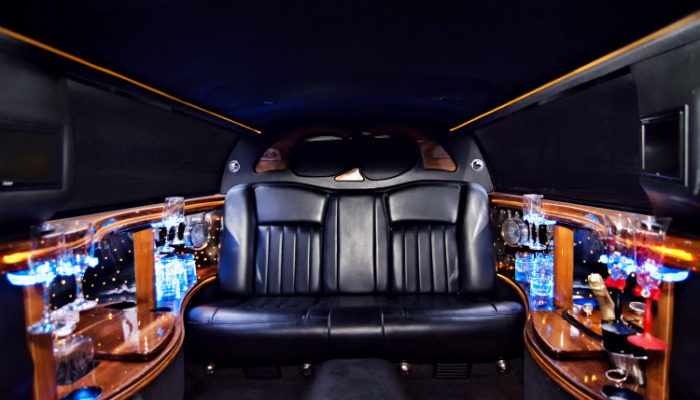 luxury limousine with great amenities interior party champagne colorful leather